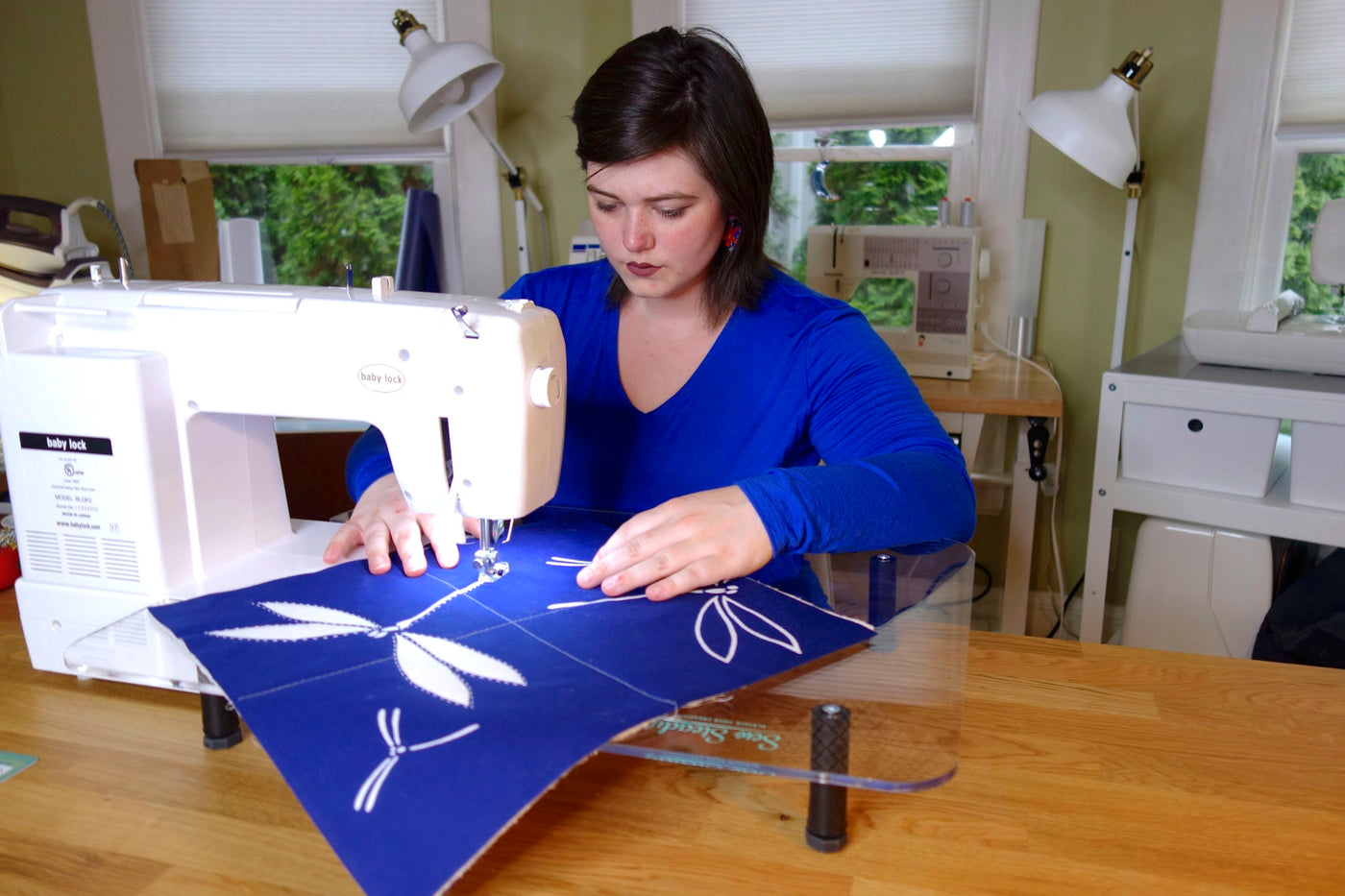 Victoria Stone of Okan Arts stitches a practice quilt tile with the Baby Lock Sashiko 2 machine